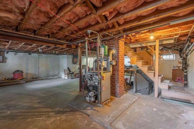 7 Prospect Ave, Dudley, MA 01571 - below grade area featuring a heating unit and stairs