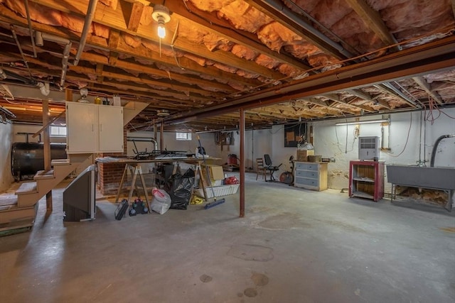 7 Prospect Ave, Dudley, MA 01571 - below grade area featuring heating fuel and a workshop area