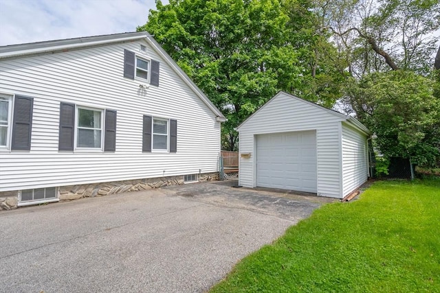 7 Prospect Ave, Dudley, MA 01571 - view of property exterior featuring an outdoor structure, a garage, and asphalt driveway