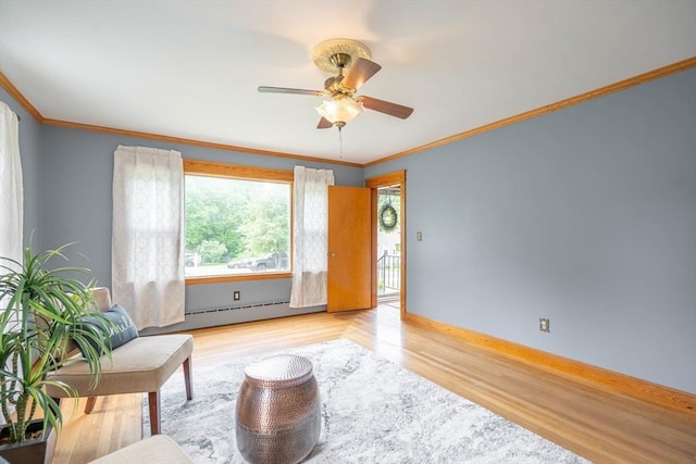 7 Prospect Ave, Dudley, MA 01571 - living area featuring light wood-type flooring, a baseboard radiator, ceiling fan, ornamental molding, and baseboards