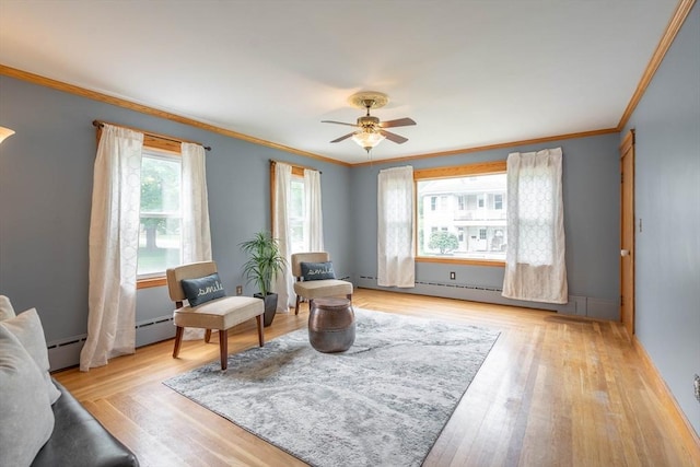 7 Prospect Ave, Dudley, MA 01571 - sitting room with crown molding, ceiling fan, light wood-type flooring, and a baseboard heating unit