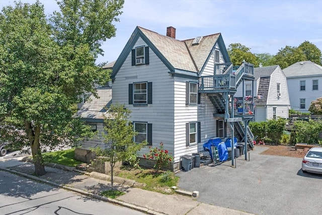 343 Cabot St, Beverly, MA 01915 - view of property exterior featuring a chimney and cooling unit