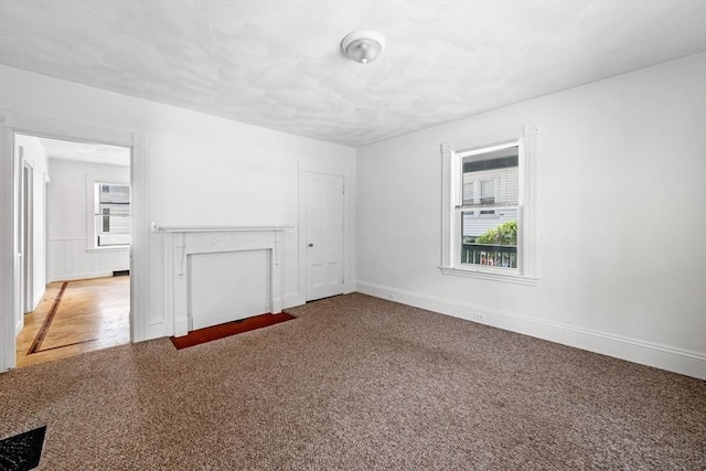 343 Cabot St, Beverly, MA 01915 - unfurnished living room featuring plenty of natural light and carpet flooring