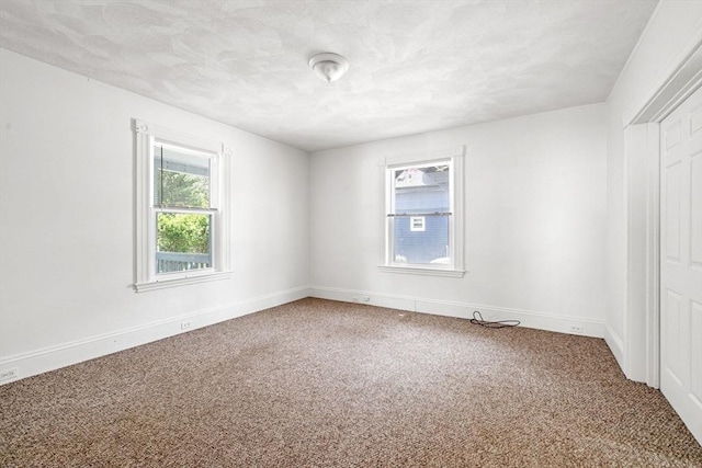343 Cabot St, Beverly, MA 01915 - carpeted empty room with baseboards