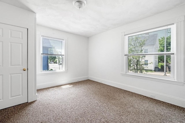 343 Cabot St, Beverly, MA 01915 - carpeted empty room featuring plenty of natural light