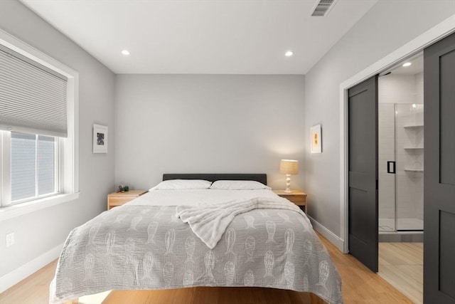 bedroom featuring light wood-style floors, baseboards, and recessed lighting