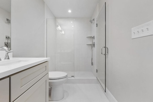 bathroom with walk in shower, vanity, and toilet