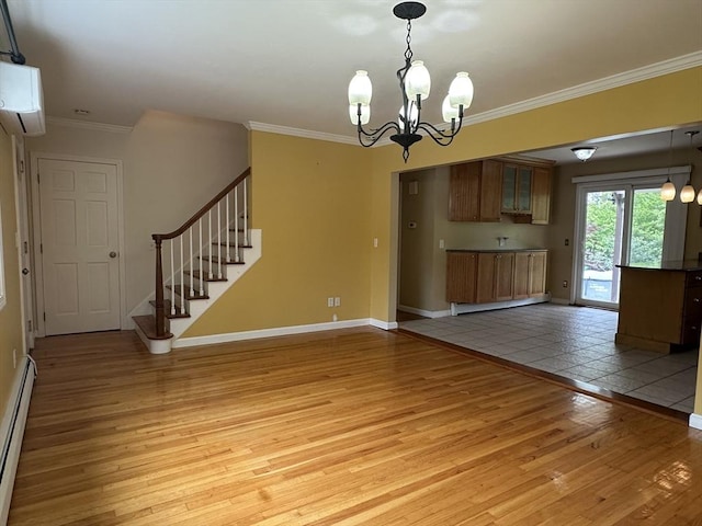 510 Sharps Lot Rd, Swansea, MA 02777 - unfurnished living room featuring light wood-type flooring, crown molding, baseboard heating, a chandelier, and baseboards