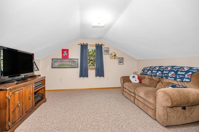 carpeted living area with lofted ceiling and baseboards
