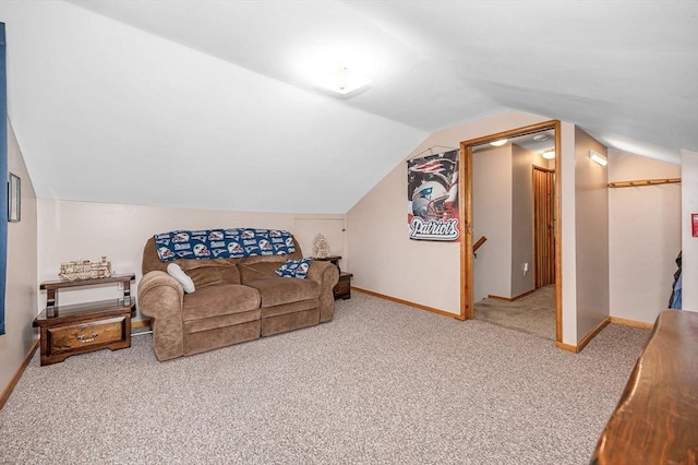 carpeted living room with vaulted ceiling and baseboards