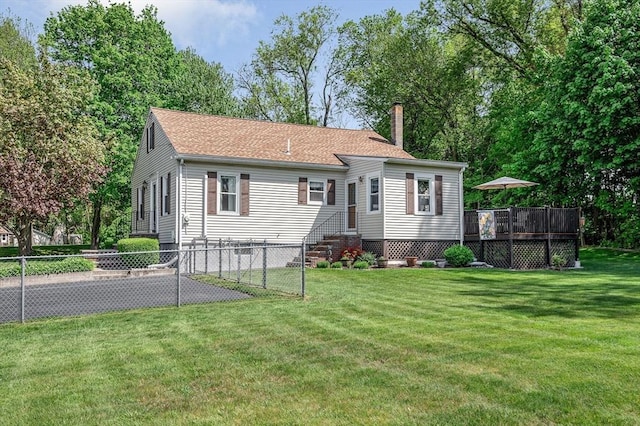 view of front of house featuring a chimney, a wooden deck, and a shingled roof