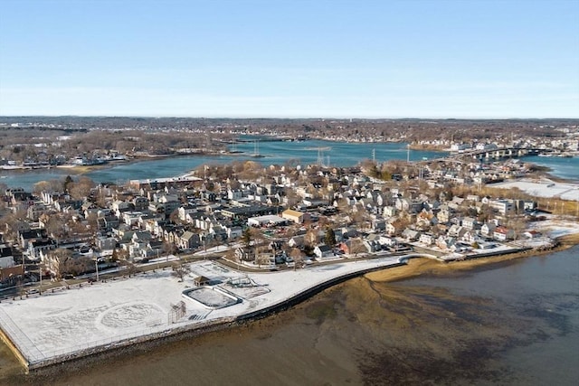 birds eye view of property with a water view and a view of the beach