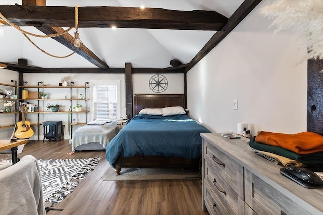 bedroom featuring dark wood-type flooring and vaulted ceiling with beams