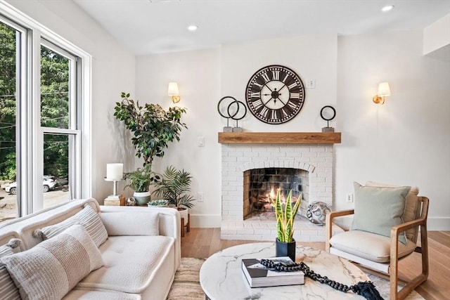 1 Archer St, Swampscott, MA 01907 - living room featuring wood finished floors, a brick fireplace, and recessed lighting