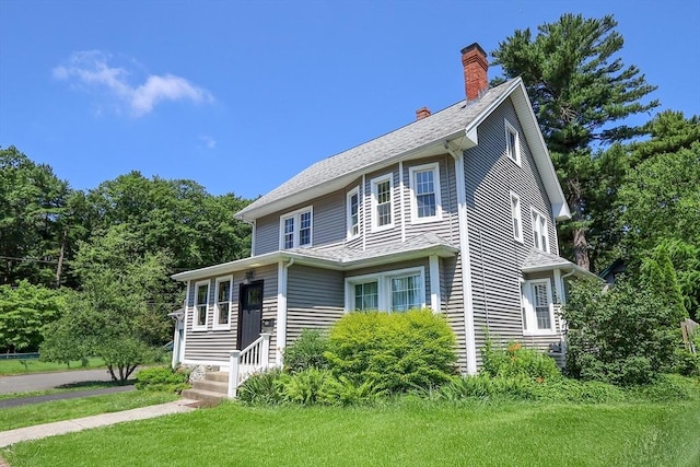 88 Biltmore St, Springfield, MA 01108 - view of front of house featuring a chimney and a front lawn
