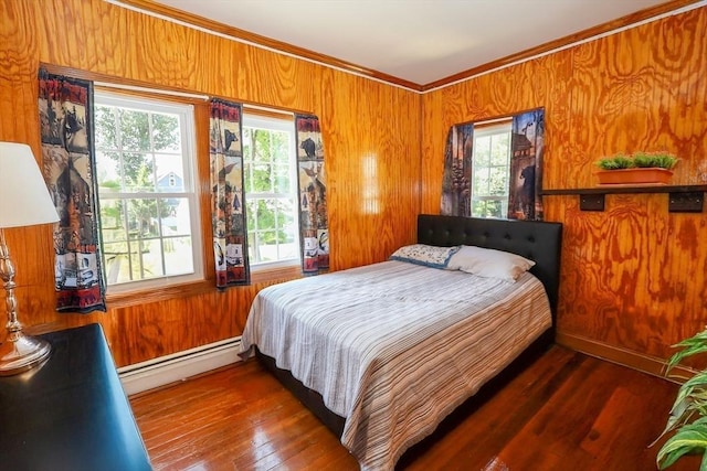 88 Biltmore St, Springfield, MA 01108 - bedroom with baseboard heating, crown molding, wood walls, and hardwood / wood-style floors