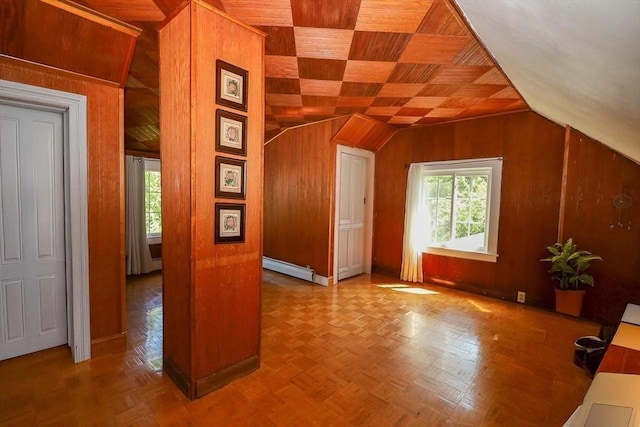 88 Biltmore St, Springfield, MA 01108 - additional living space with wood walls, a baseboard heating unit, and lofted ceiling