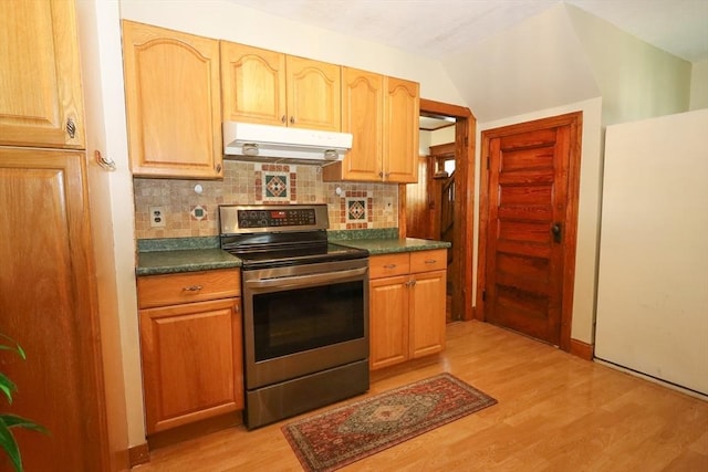 88 Biltmore St, Springfield, MA 01108 - kitchen with stainless steel range with electric cooktop, under cabinet range hood, freestanding refrigerator, light wood finished floors, and dark countertops