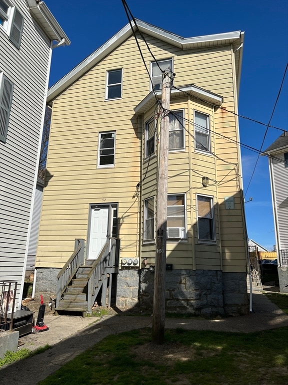 back of property featuring cooling unit