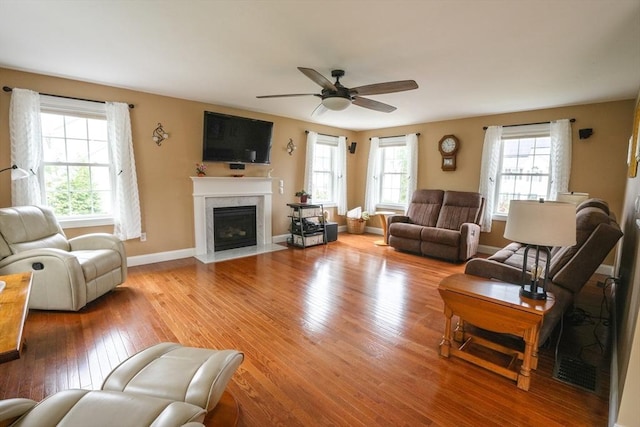 9 Gideon Ln, Shirley, MA 01464 - living area with plenty of natural light, light wood-style flooring, and a fireplace