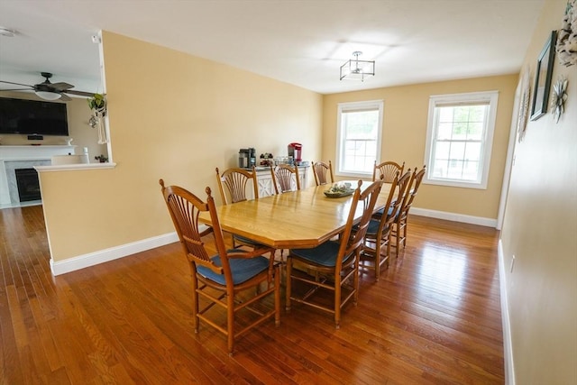 9 Gideon Ln, Shirley, MA 01464 - dining space featuring a ceiling fan, wood finished floors, baseboards, and a fireplace