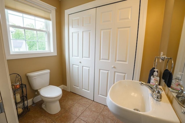 9 Gideon Ln, Shirley, MA 01464 - bathroom featuring toilet, a sink, tile patterned floors, a closet, and baseboards