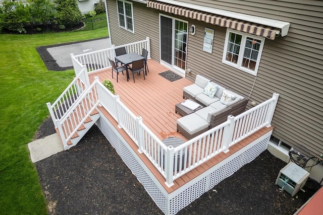 9 Gideon Ln, Shirley, MA 01464 - wooden deck with outdoor dining area, outdoor lounge area, and a lawn