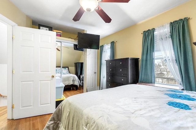 bedroom featuring hardwood / wood-style flooring, a closet, and ceiling fan