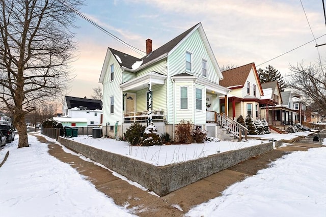 view of front of house with central air condition unit