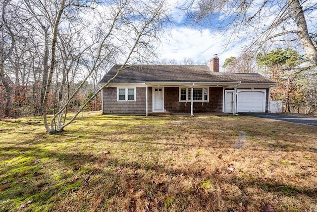 ranch-style house with a porch, a front yard, and a garage