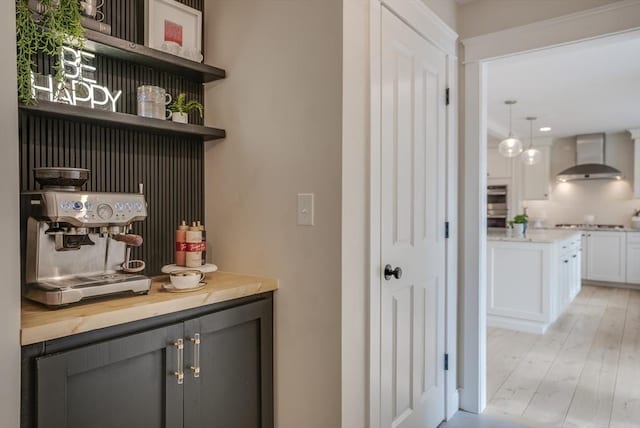 41 Pleasant St, Holliston, MA 01746 - bar with wall chimney exhaust hood and light wood-style flooring