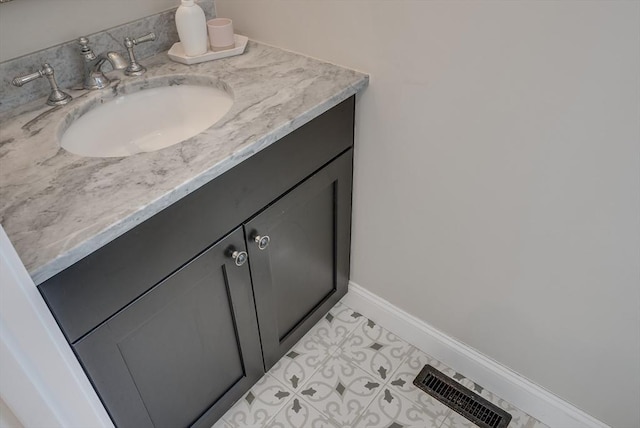 41 Pleasant St, Holliston, MA 01746 - bathroom with vanity, baseboards, and tile patterned flooring