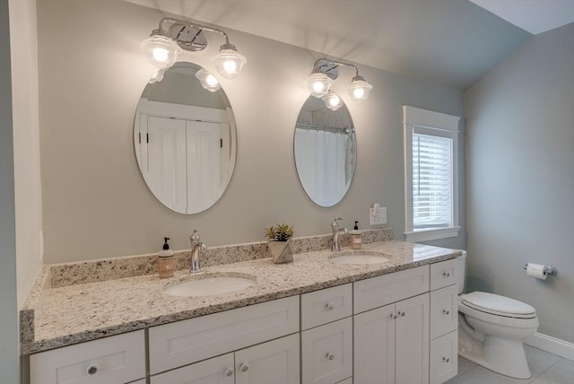 41 Pleasant St, Holliston, MA 01746 - bathroom with double vanity, toilet, tile patterned floors, a shower with shower curtain, and baseboards