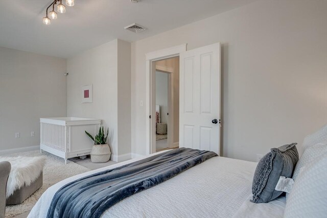 41 Pleasant St, Holliston, MA 01746 - carpeted bedroom featuring baseboards