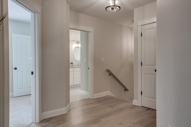41 Pleasant St, Holliston, MA 01746 - hall featuring an upstairs landing, light wood finished floors, and baseboards