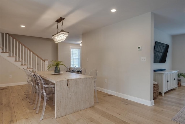 41 Pleasant St, Holliston, MA 01746 - dining area featuring light wood-type flooring, baseboards, recessed lighting, and stairs