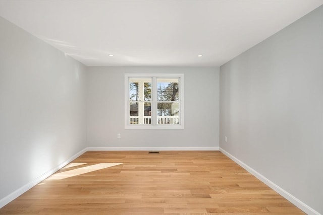 unfurnished room with light hardwood / wood-style flooring