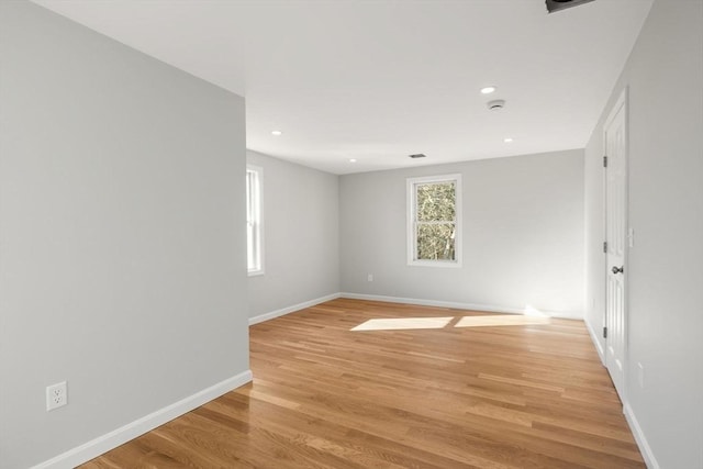 spare room with light hardwood / wood-style floors