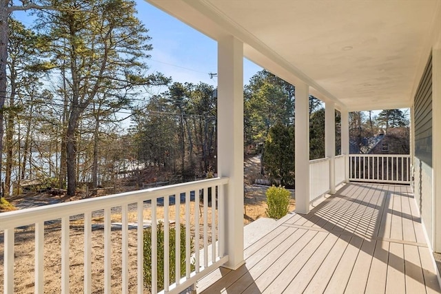 wooden terrace featuring covered porch