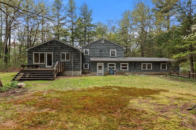 9 Flagg Rd, Acton, MA 01720 - back of house featuring a deck and a lawn