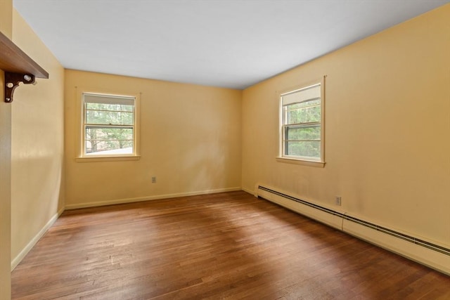 9 Flagg Rd, Acton, MA 01720 - spare room featuring a baseboard heating unit, wood finished floors, and baseboards