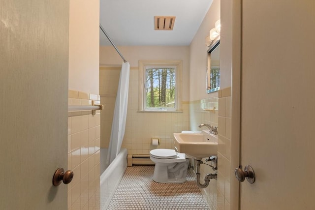9 Flagg Rd, Acton, MA 01720 - bathroom with tile walls, toilet, wainscoting, shower / bathtub combination with curtain, and a baseboard radiator