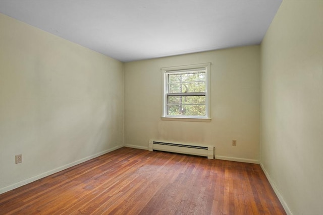 9 Flagg Rd, Acton, MA 01720 - spare room with a baseboard radiator, wood finished floors, and baseboards