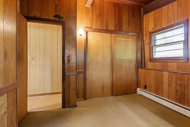 9 Flagg Rd, Acton, MA 01720 - unfurnished bedroom featuring baseboard heating and wooden walls