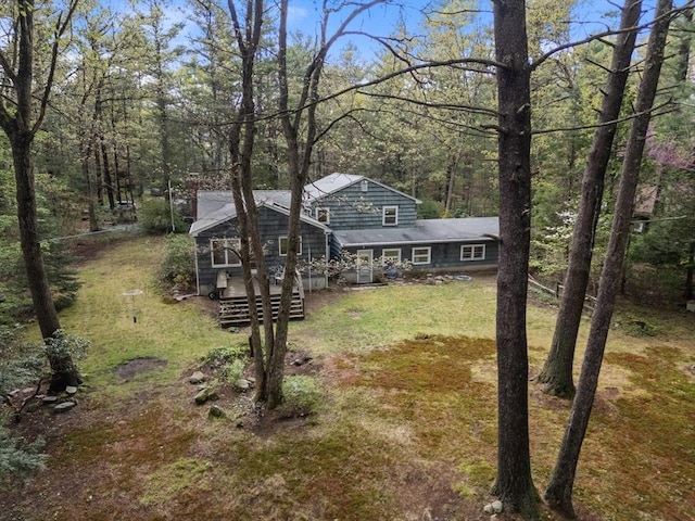 9 Flagg Rd, Acton, MA 01720 - view of front of house with a front yard, a chimney, and a wooded view