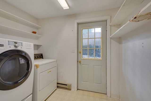 laundry room with washing machine and dryer and a baseboard heating unit