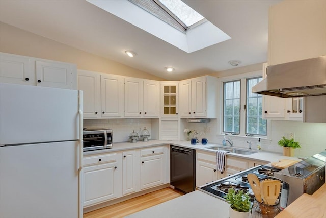 kitchen with sink, dishwasher, white refrigerator, island range hood, and white cabinets