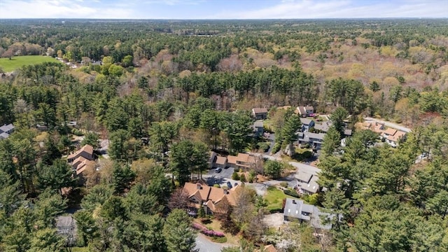 birds eye view of property featuring a forest view