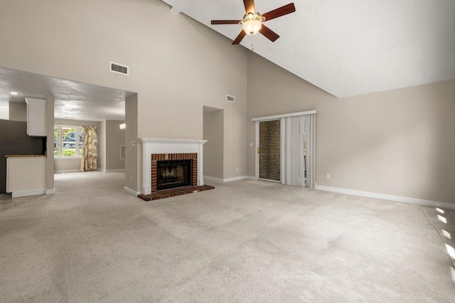 unfurnished living room with high vaulted ceiling, baseboards, a ceiling fan, and visible vents