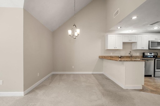 kitchen featuring baseboards, light carpet, visible vents, and appliances with stainless steel finishes